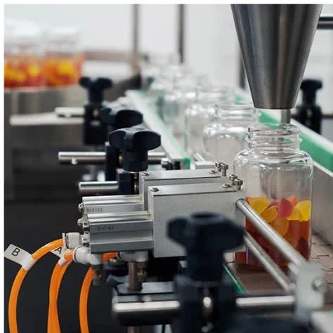 Automated line filling jars with finished gummies
